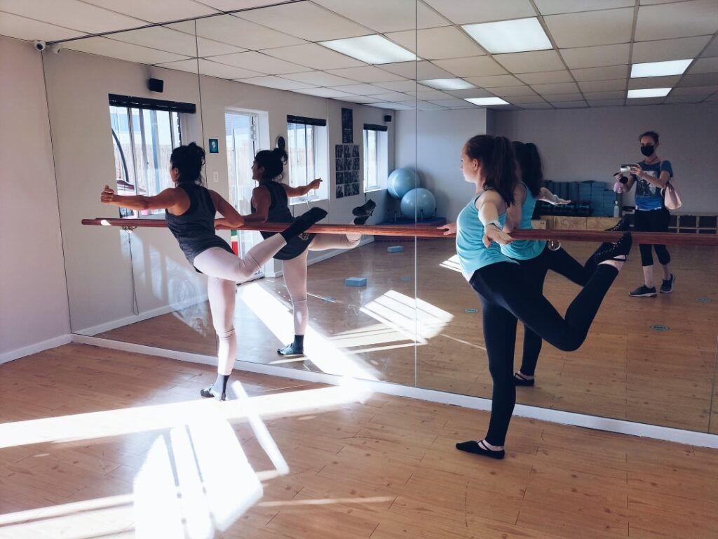 Senior contemporary modern ballet students enjoying leg work & arabesque training