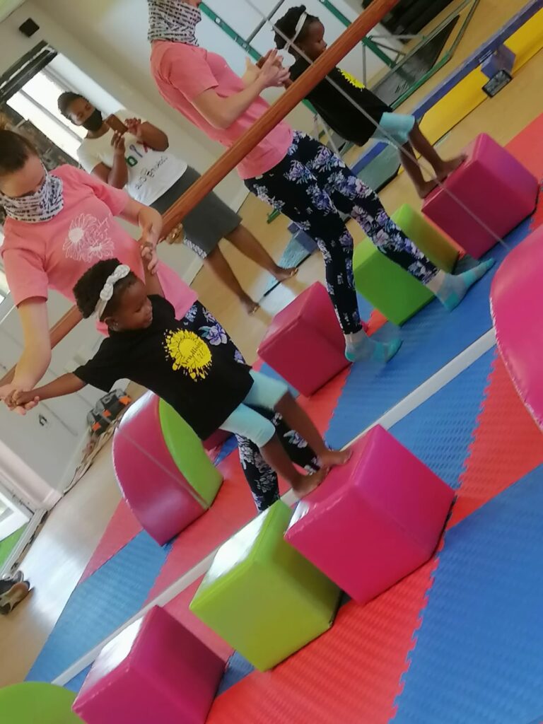 Junior Flexinastix toddler balancing during gymnastics based fitness class
