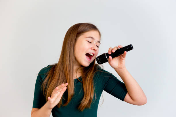 Student singing in music lesson