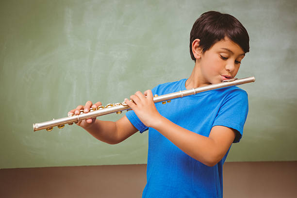 student playing flute in music lesson